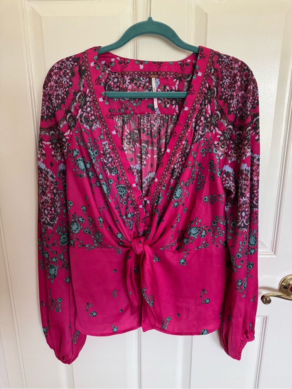 Free People long sleeved blouse size large.  EUC. Fuchsia pink silky material.